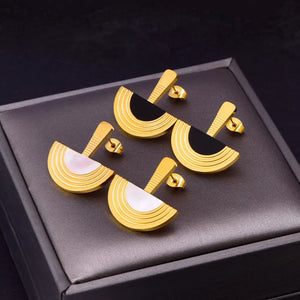 Black jewelry set featuring gold-plated and geometric