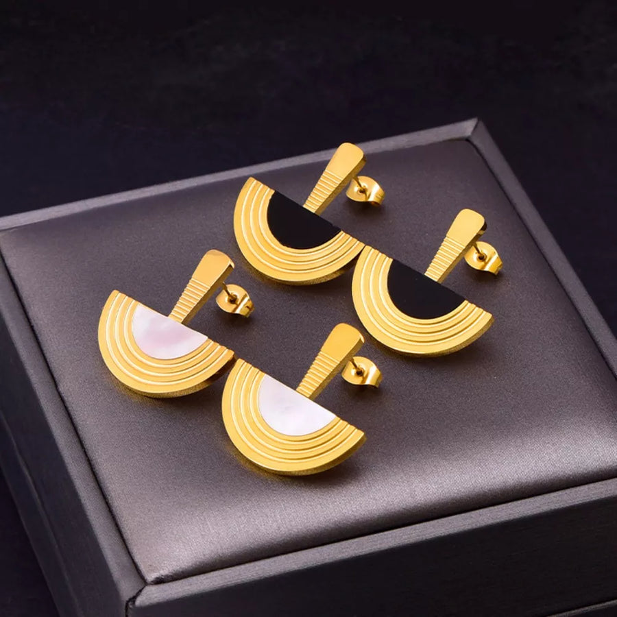 Black jewelry set featuring gold-plated and geometric