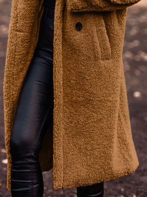 Longline teddy bear coat in camel with button closure and pocket detail.