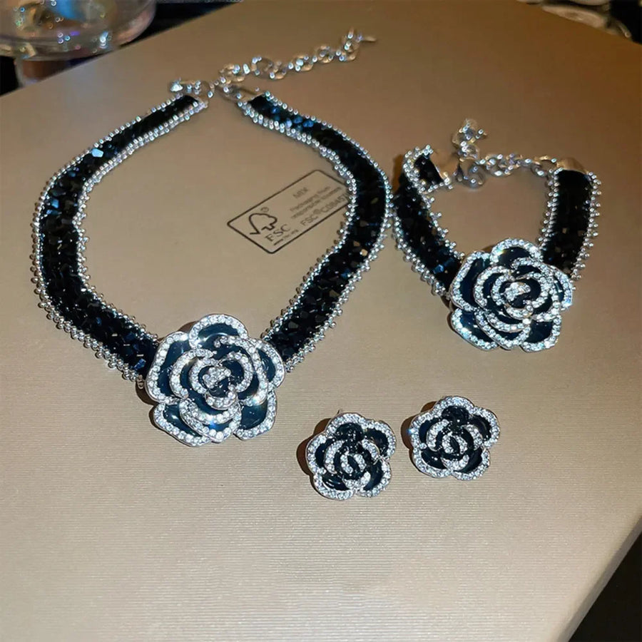 Black rose stud earrings with crystal halo detail