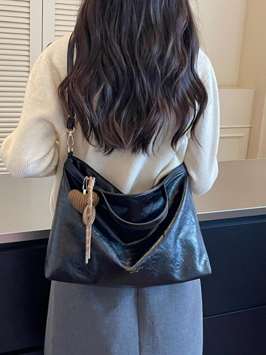 Medium Adjustable-Strap PU Leather Crossbody Bag in black with adjustable strap