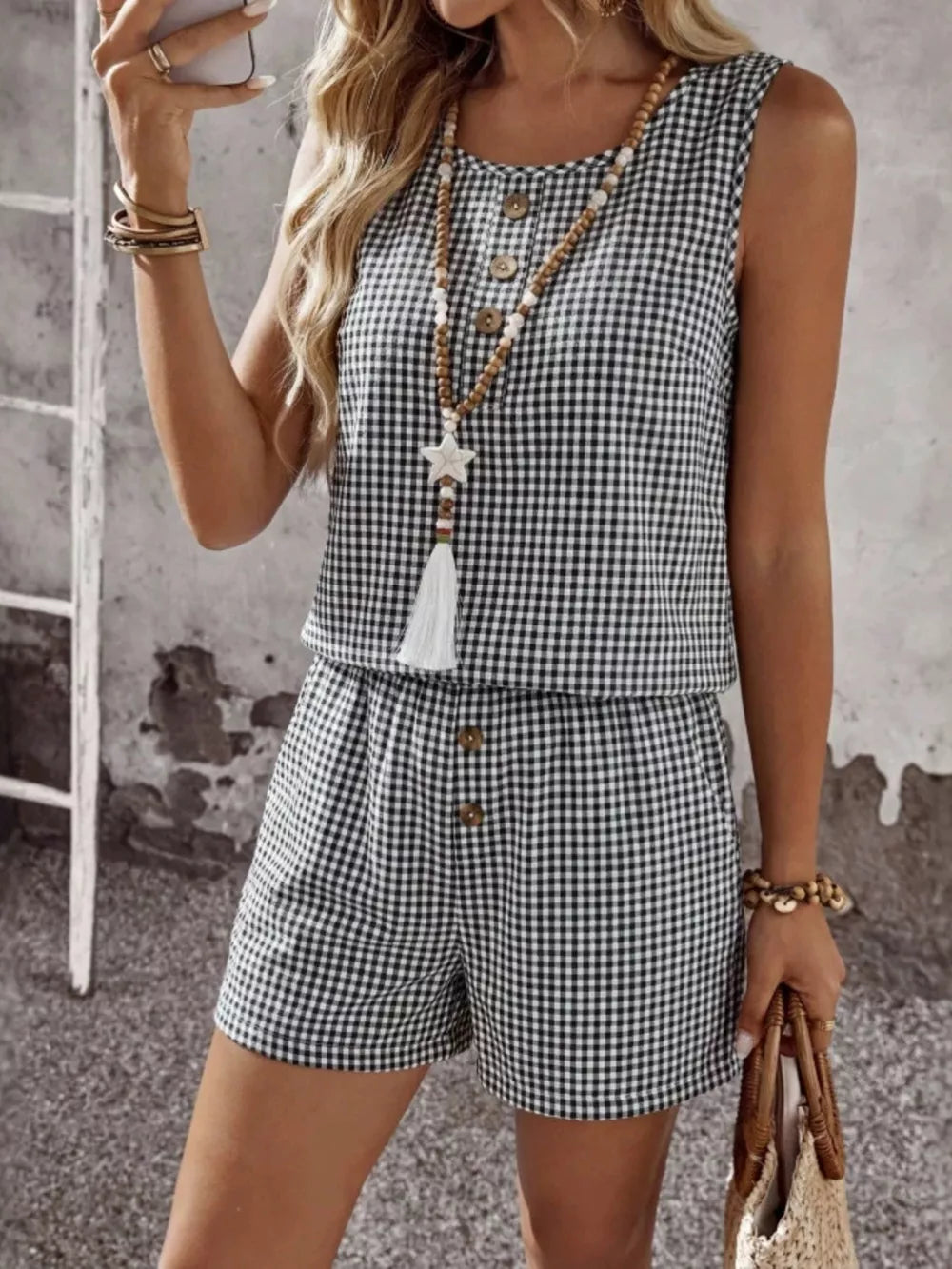 Black gingham button-down two-piece set with shorts and sleeveless top.