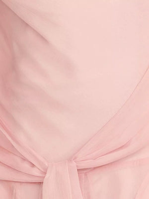 Pink maxi dress with draped knot detail and subtle vertical texture.