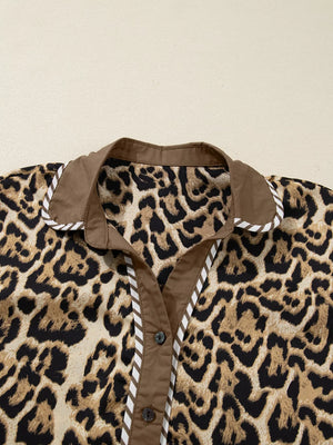 Leopard print buttoned shirt with brown collar and trim, part of a two-piece set.