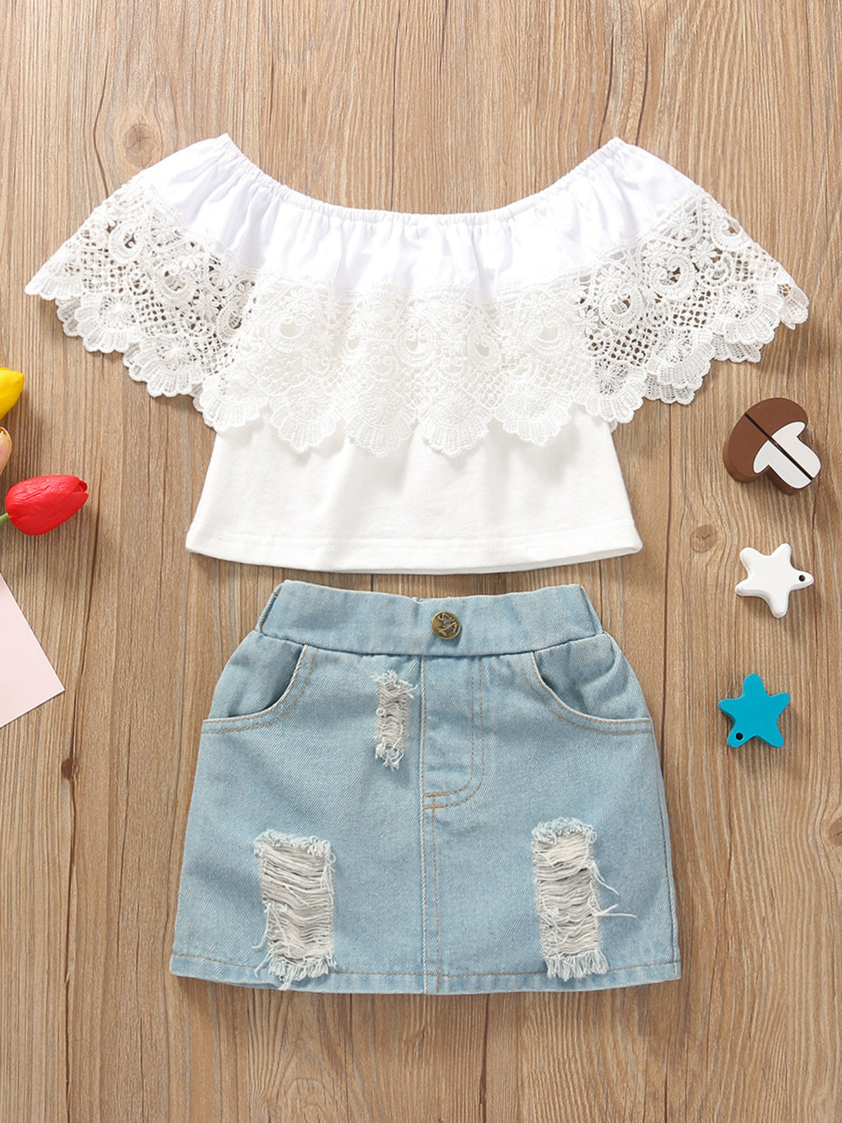 White off-shoulder lace top with distressed denim skirt set for baby girls.