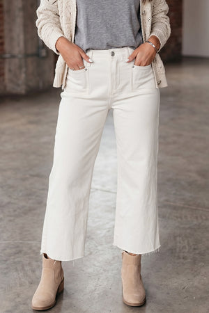 jeans in cream featuring buttoned and loose fit