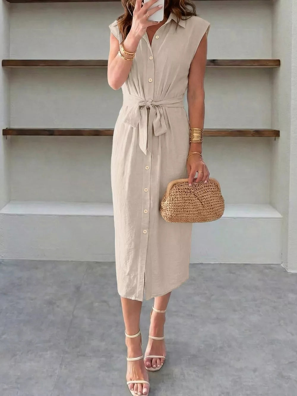 Elegant beige midi dress with tie-waist, collared neckline, and button-down front.