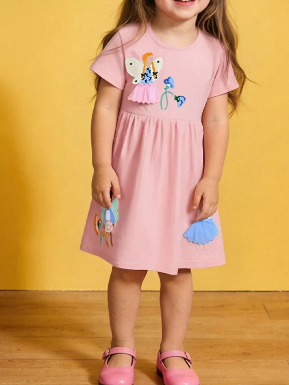 Charming appliqué cotton toddler dress with embroidered details