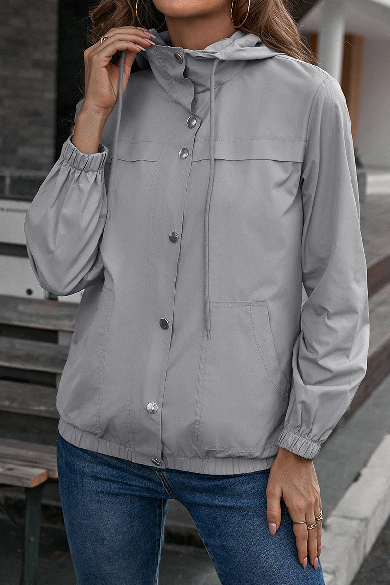 Light gray hooded utility jacket with drawstring waist and button front.