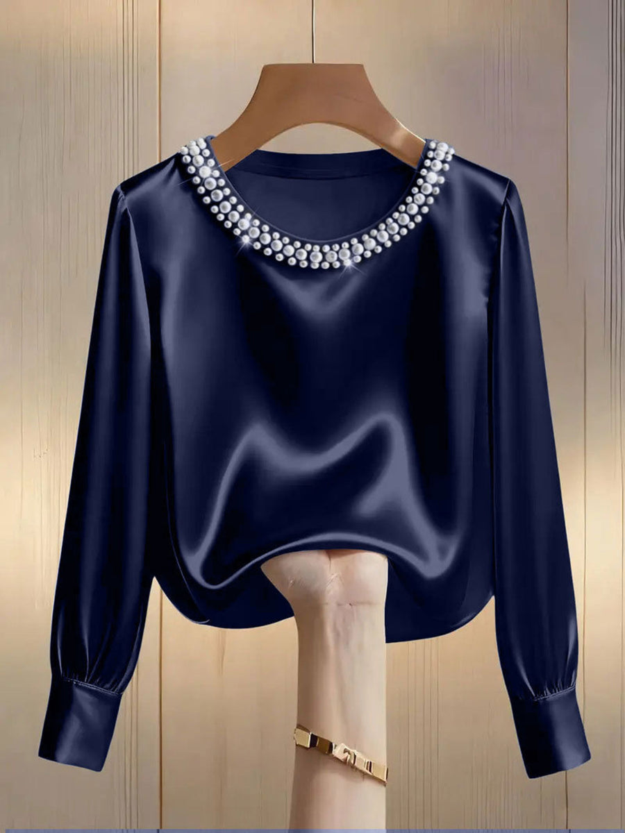 Dark blue satin blouse with pearl trim round neckline and long sleeves