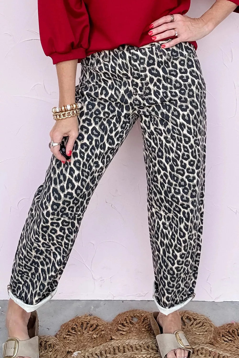 Chic cropped leopard print denim jeans with a relaxed fit and cuffed hem.