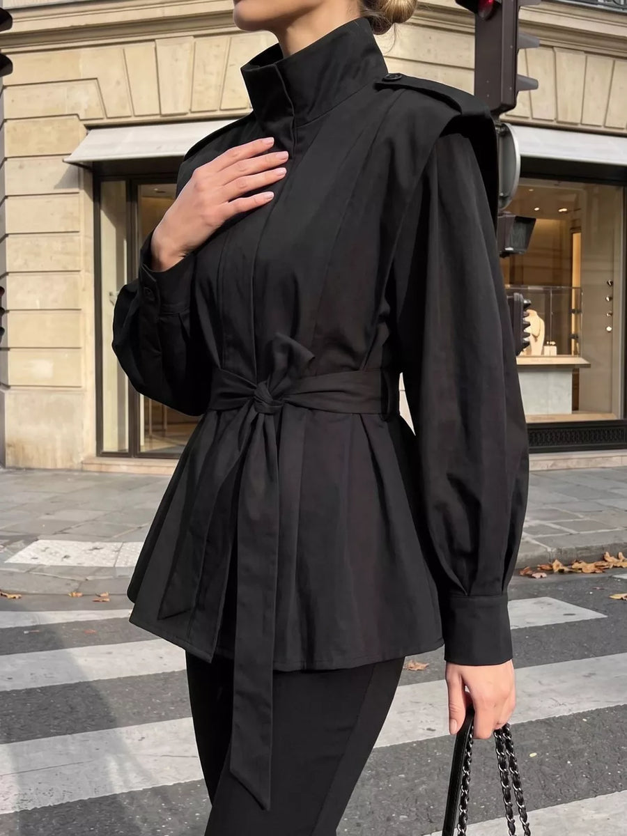 100% polyester Care instructions: Machine wash cold trench coat in Black with relaxed silhouette