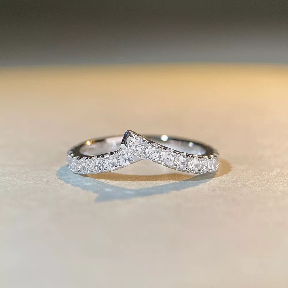 ring in silver featuring zircon embellishment and irregular band fit
