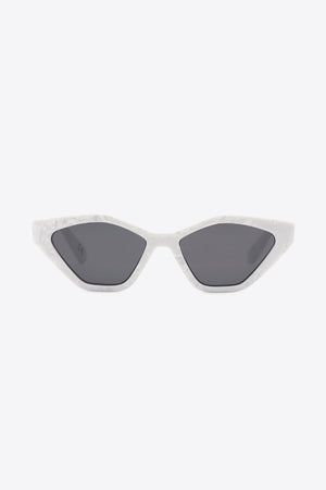 Geometric cat-eye sunglasses in light gray with dark lenses.