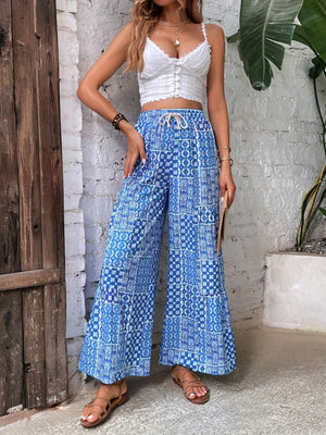 wide-leg pants in royal blue featuring high-waisted and flared fit