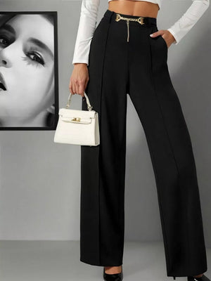 Black wide-leg high-waist maternity trousers with gold chain belt detail.