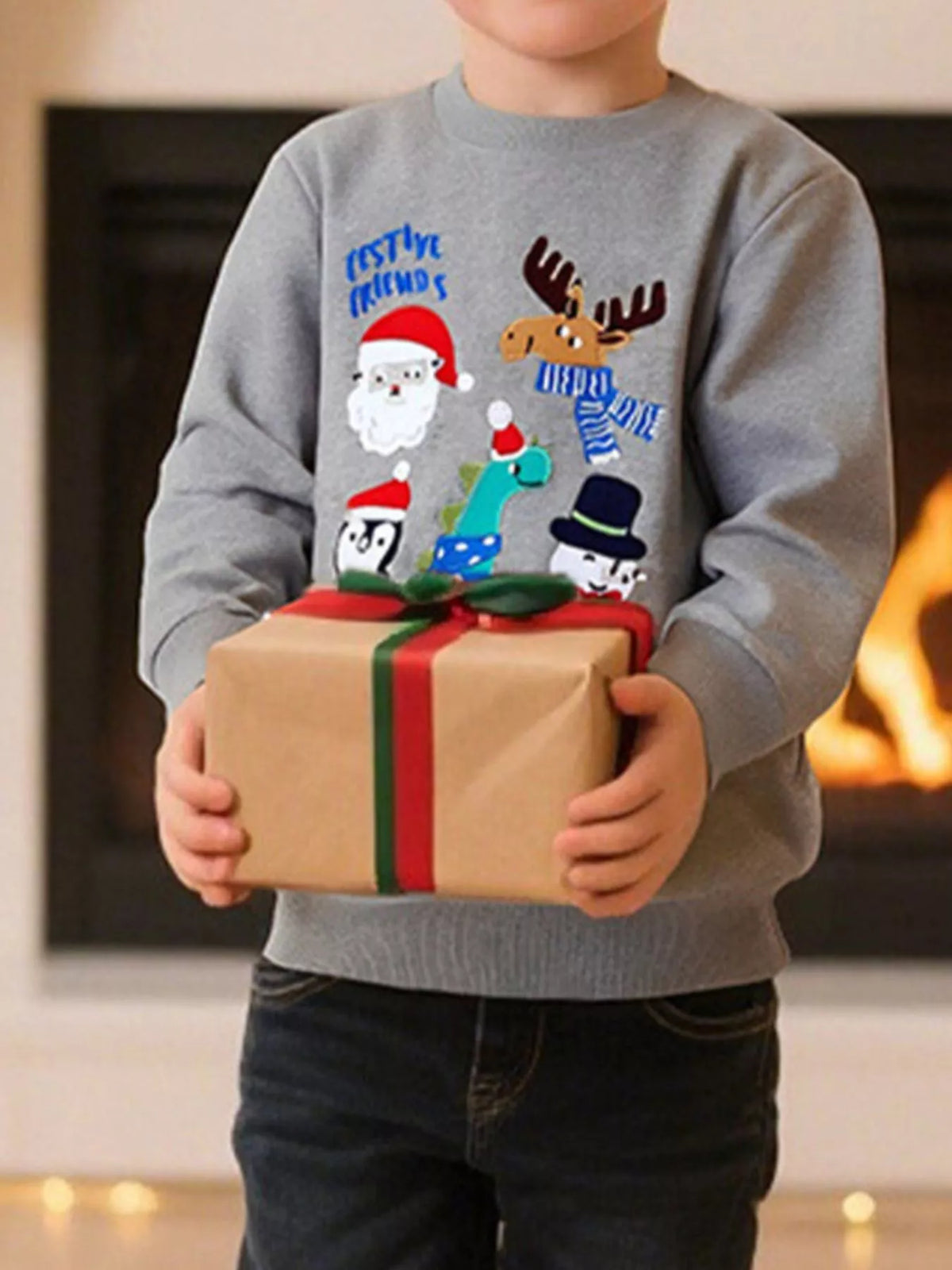 Children's gray crew neck sweatshirt with festive Christmas character appliques and text.