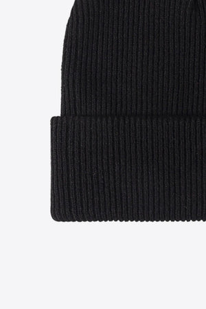 Black ribbed knit beanie with a cuffed hem