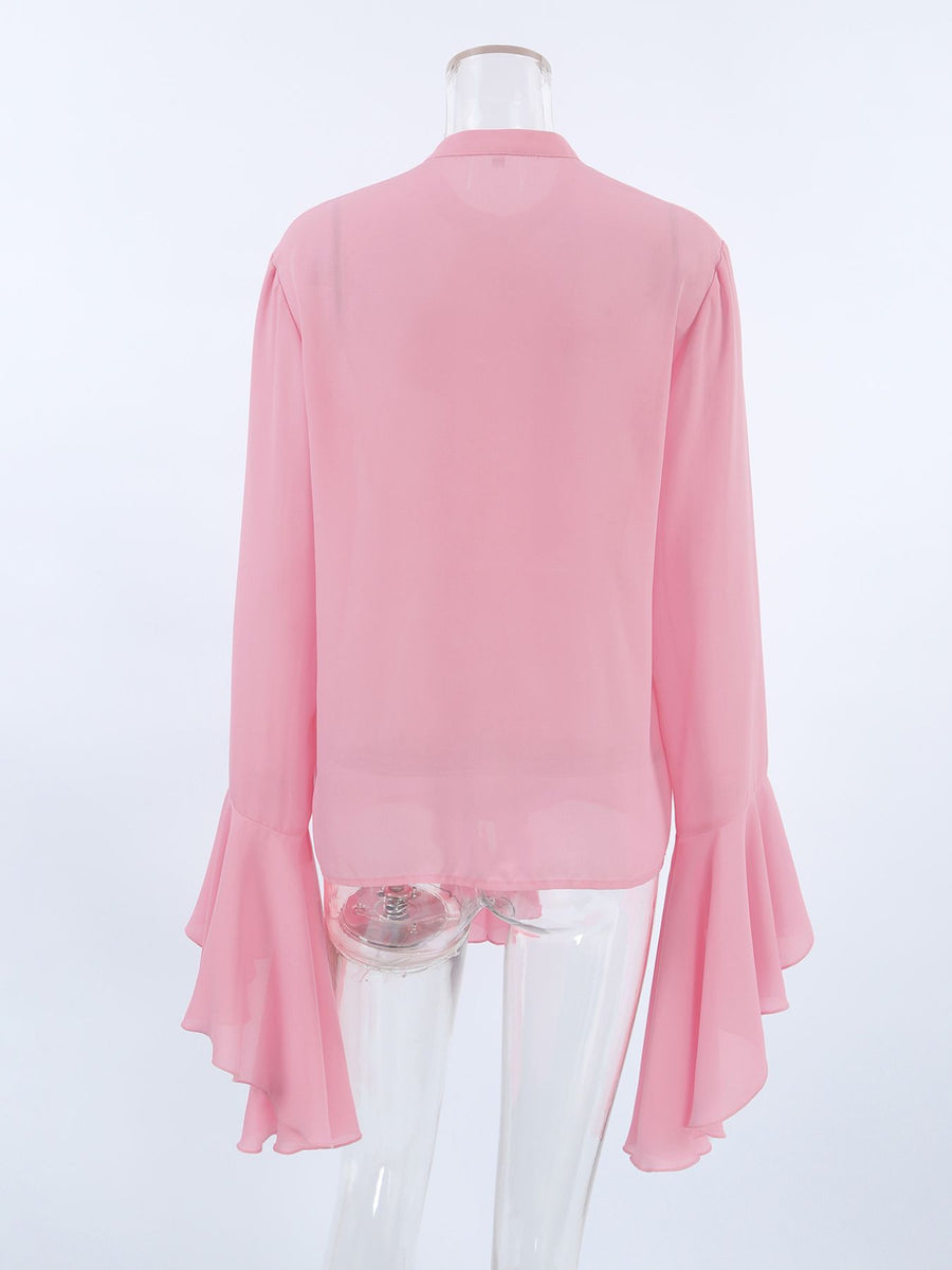 Pink ruffled flounce sleeve blouse with buttoned front and airy fabric.