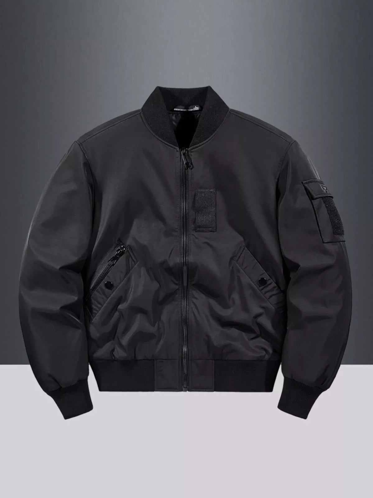 Classic black bomber jacket with zip front, ribbed collar, cuffs, and hem, and utility pockets.