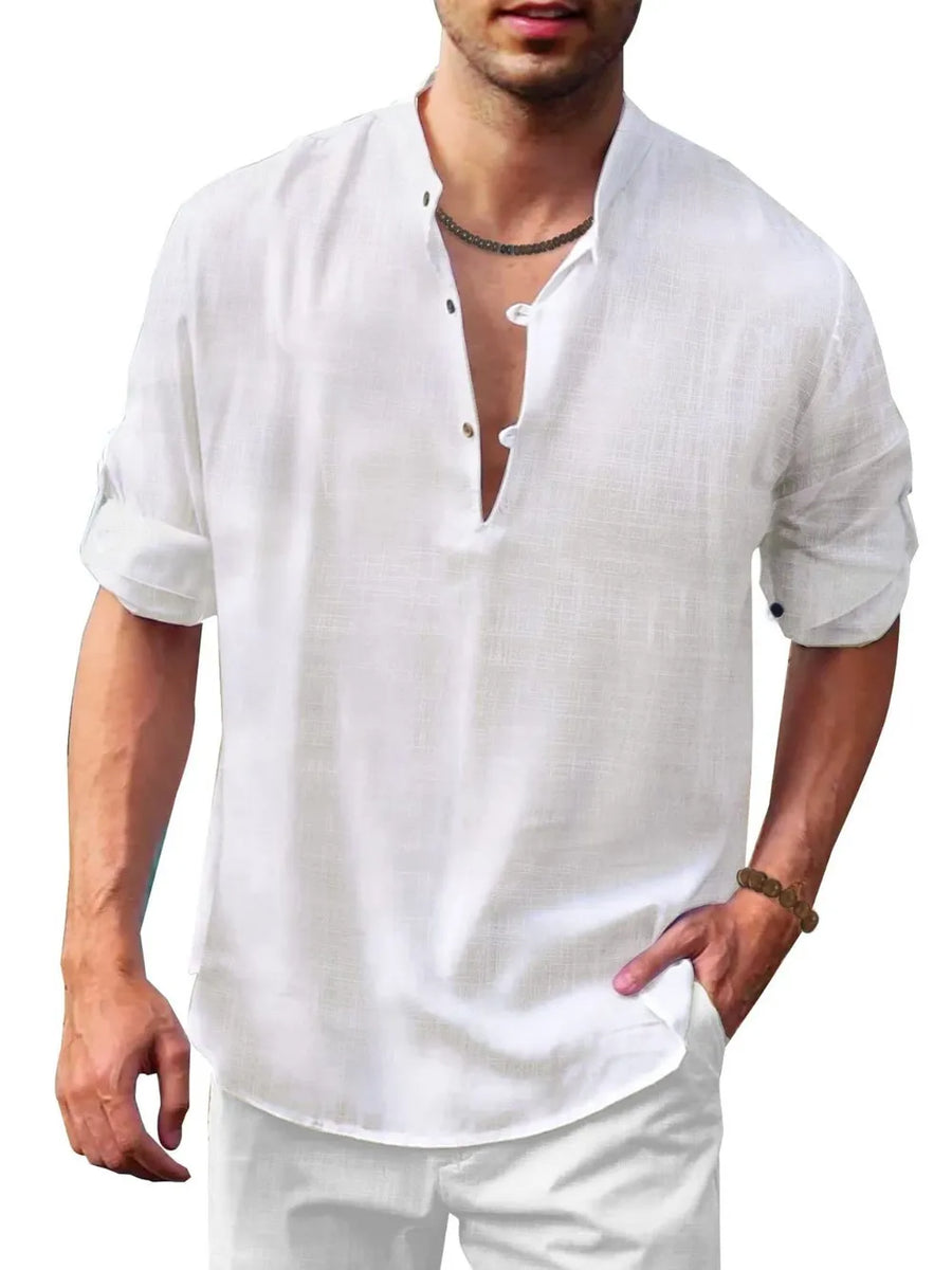 White linen henley shirt with mandarin collar and roll-up sleeves.