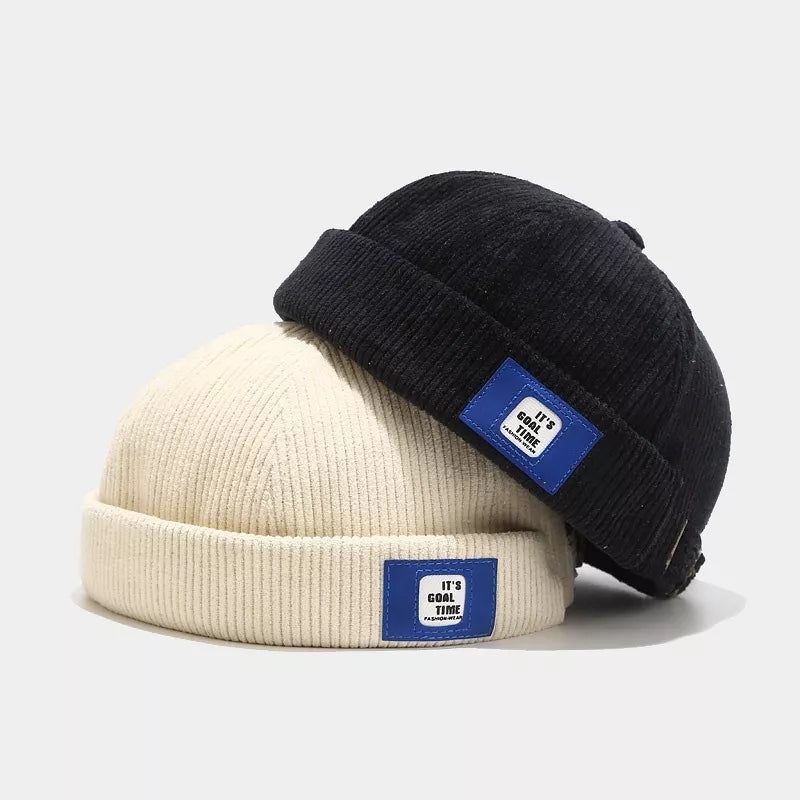 hat in black featuring adjustable and fitted fit