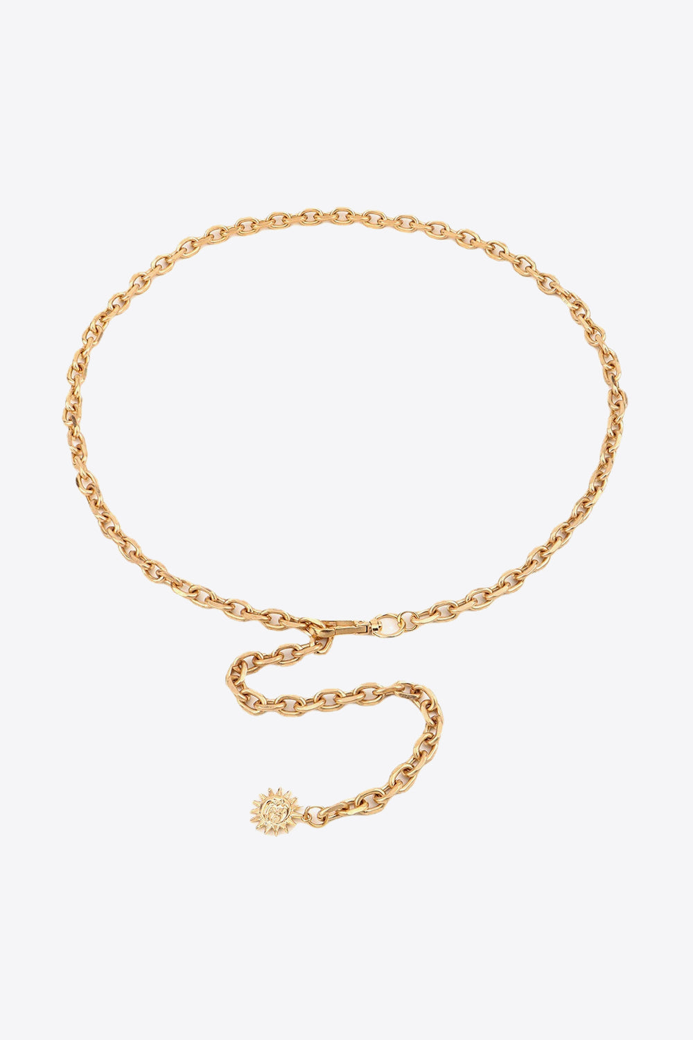 Gold chain waist belt with sunburst charm and adjustable clasp