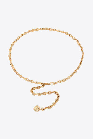 Gold chain waist belt with sunburst charm and adjustable clasp