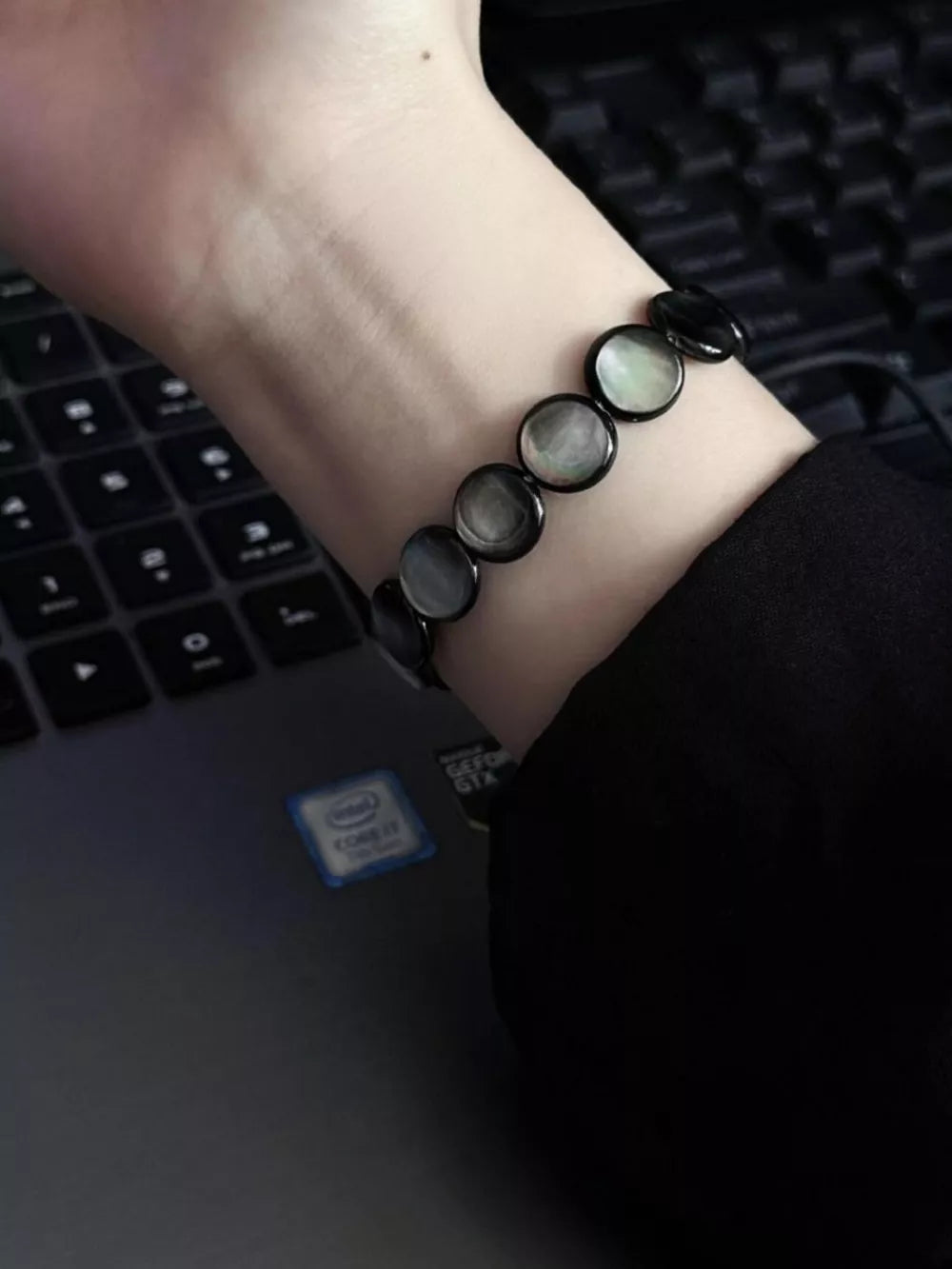 bracelet in black featuring elastic and straight fit