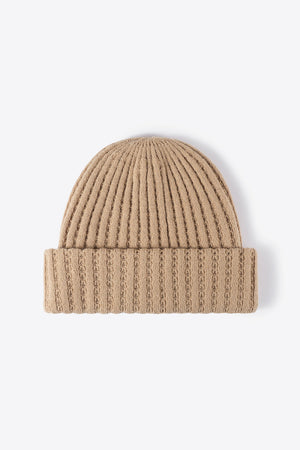 Beige ribbed knit beanie with textured detail