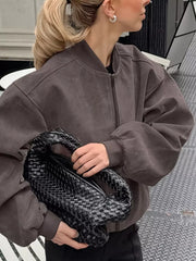bomber jacket in charcoal brown featuring zipper and oversized fit