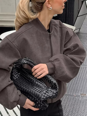 bomber jacket in charcoal brown featuring zipper and oversized fit