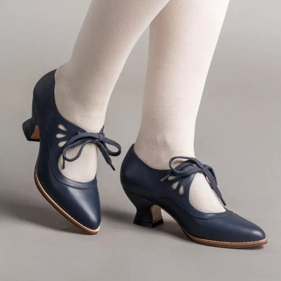 Navy leather Mary Jane heels with cutouts and lace-up detail