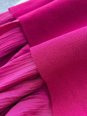 Sheer two-piece set in magenta with textured fabric and subtle button details.