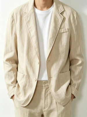 Khaki long sleeve sport jacket with notched lapels, two buttons, and flap pockets.