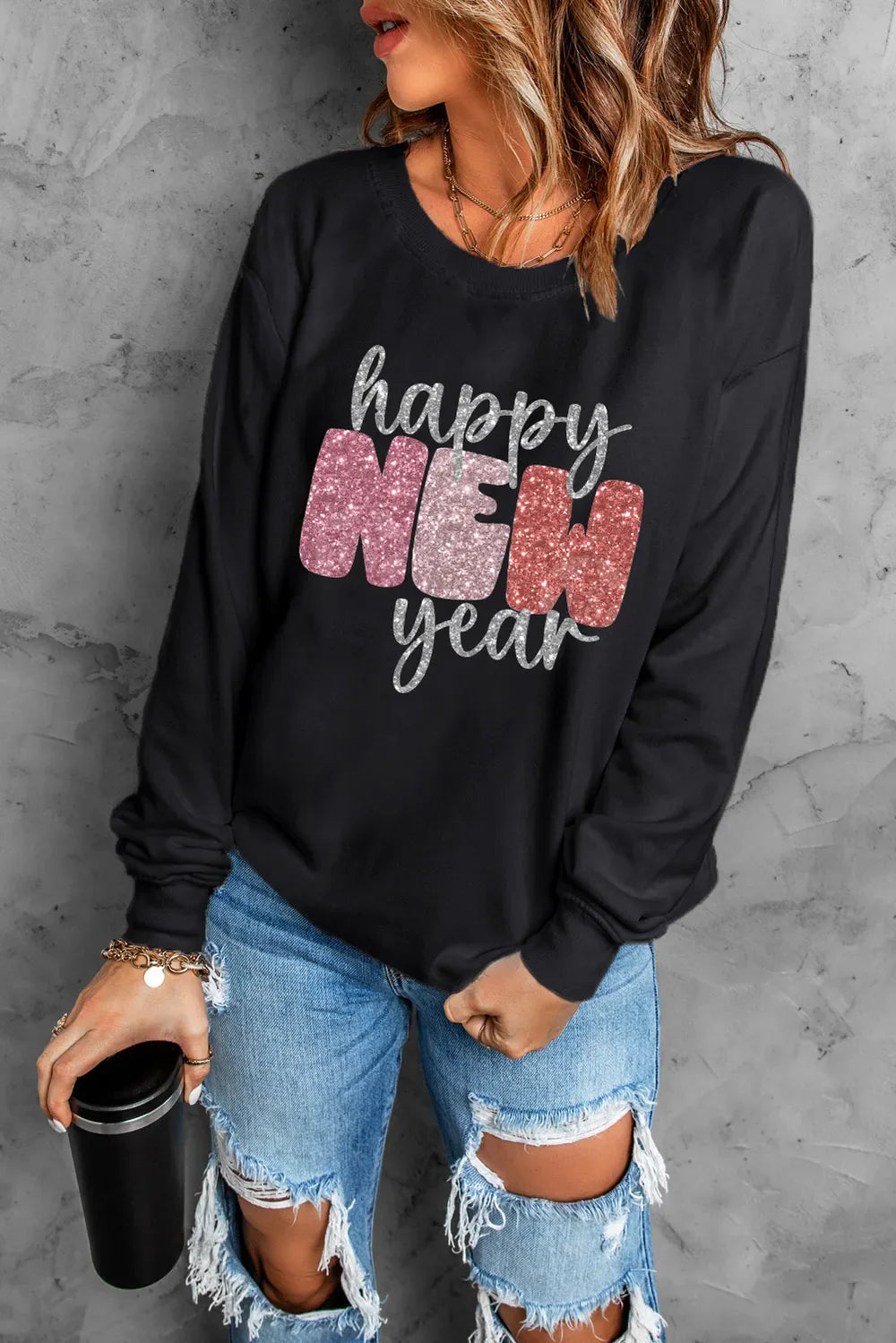 Black sweatshirt with glittered "Happy New Year" graphic and crew neck.