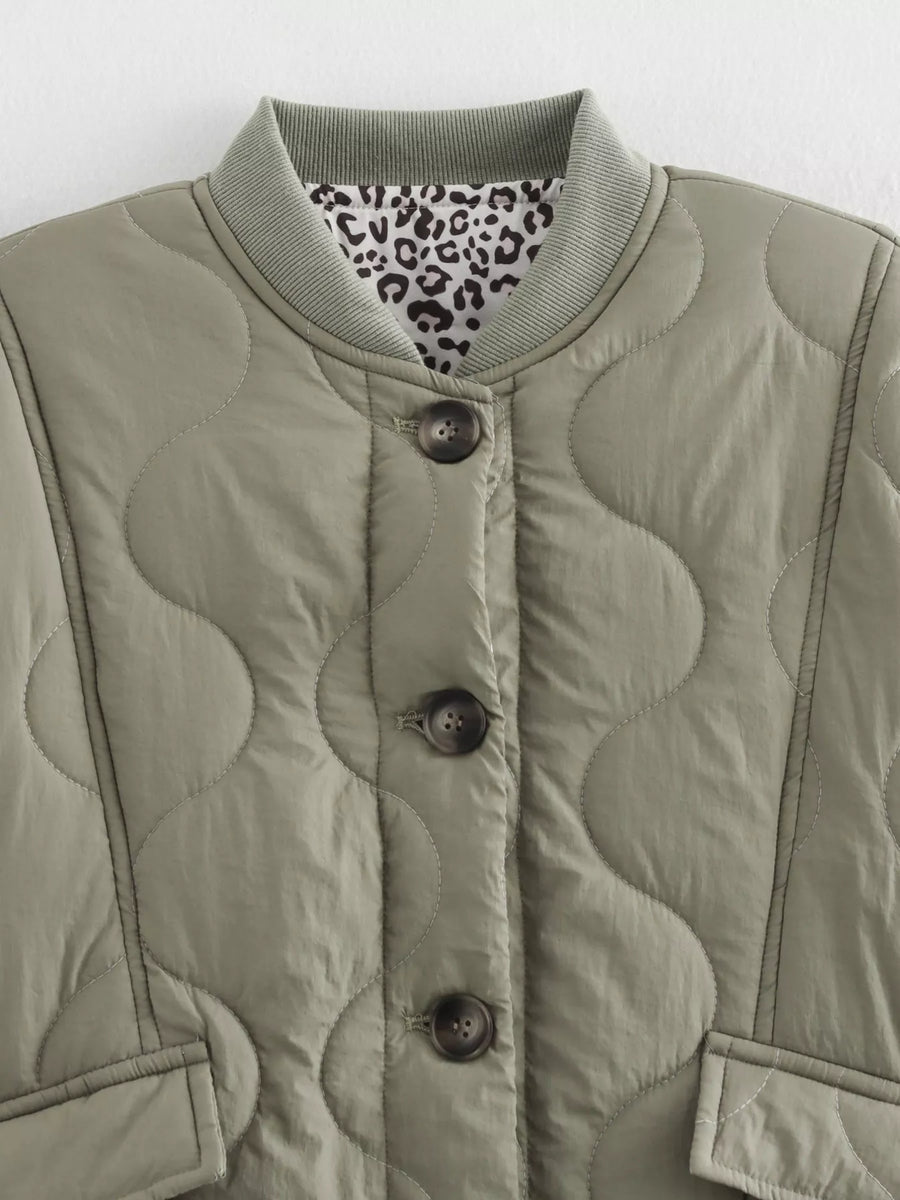 Moss quilted button-down jacket with leopard print lining and ribbed collar.