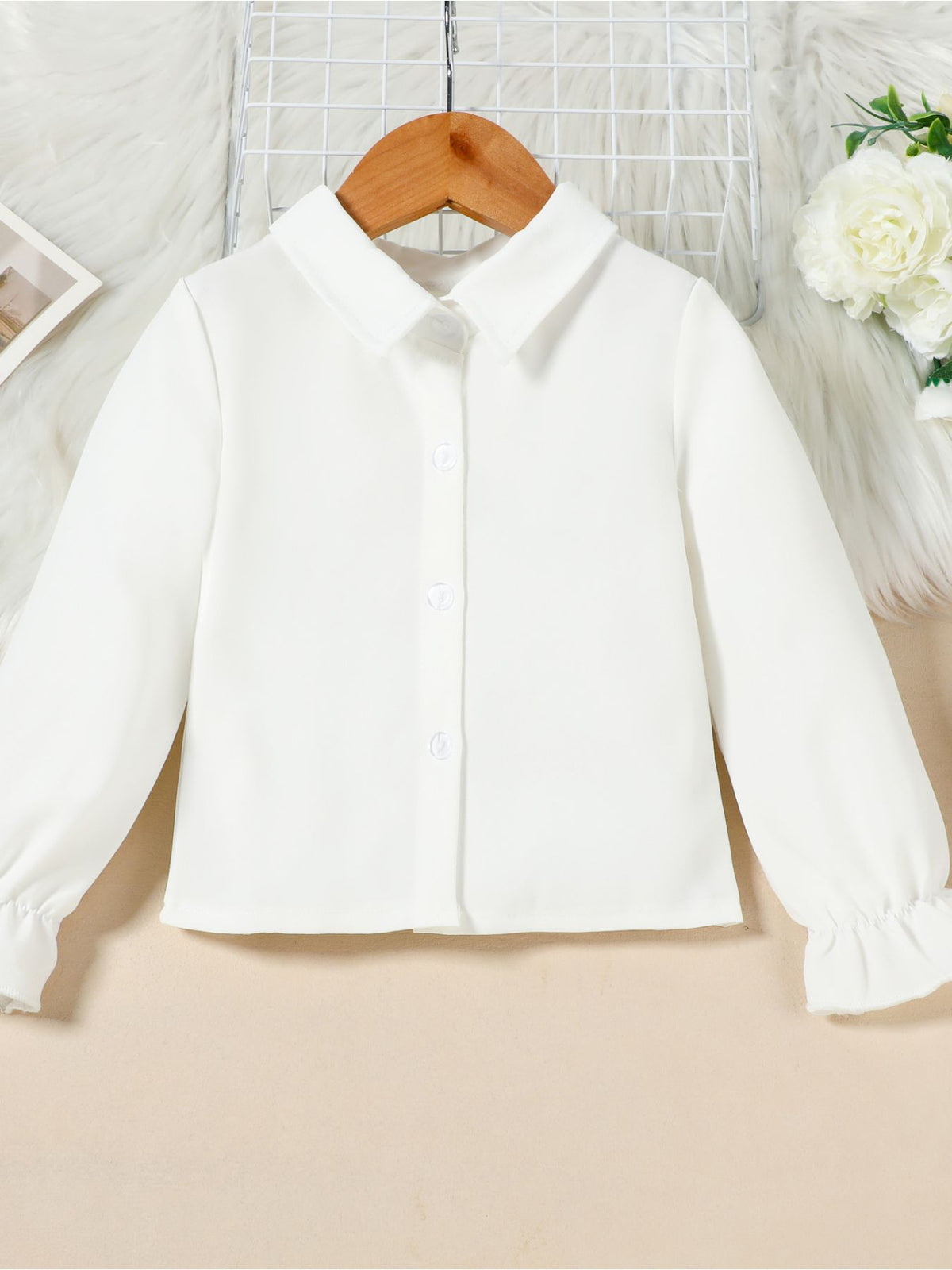 White cotton toddler shirt with button front and flounce cuffs