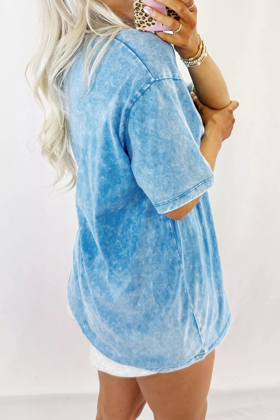 Maternity acid wash tee in blue with short sleeves and a relaxed fit.