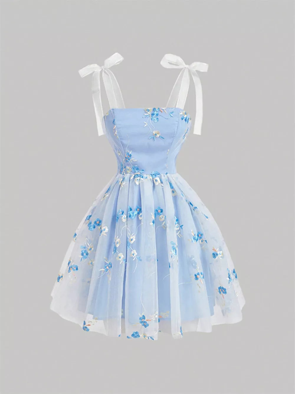 Blue floral embroidered mini dress with tie shoulder straps and a tulle overlay.