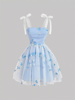 Blue floral embroidered mini dress with tie shoulder straps and a tulle overlay.