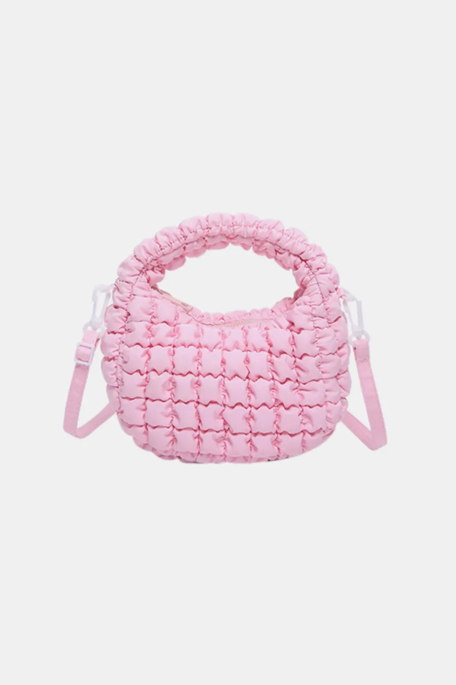 Pink padded crescent crossbody bag with sculptural texture and ruched handle