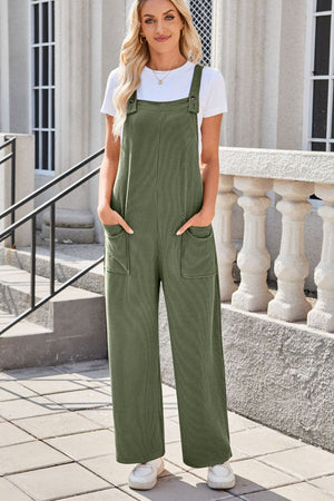 Moss green striped denim overalls with patch pockets and wide legs.