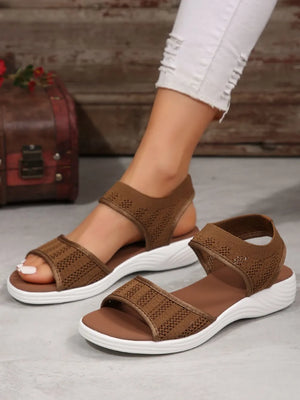 Brown mesh peep sandals with white soles and elastic straps.
