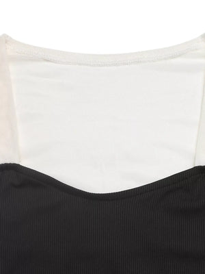 Black and white ribbed long-sleeve bodysuit with sheer neckline detail