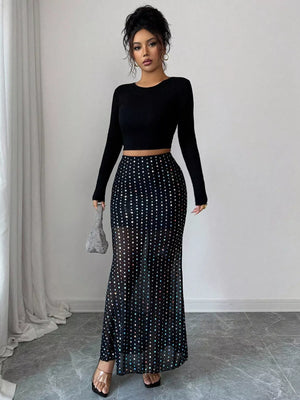 Black sheer polka dot maxi skirt with sparkling embellishments.