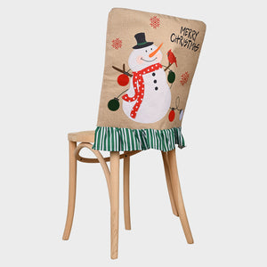 Burlap chair cover with snowman applique and green striped ruffle trim.
