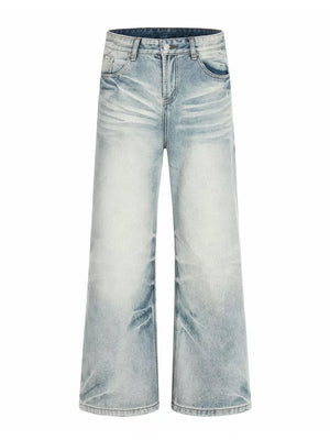 Men's light blue vintage wash wide leg jeans with distressed details.