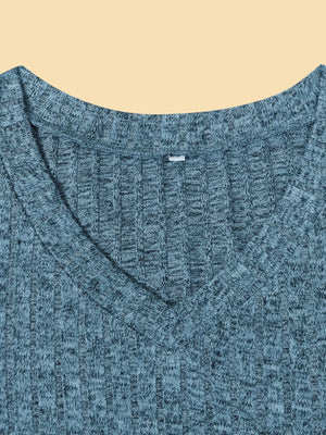 Blue textured V-neck knit long-sleeve top with a ribbed pattern.