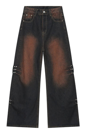Acid wash flare jeans in dark denim with stud details on the legs.